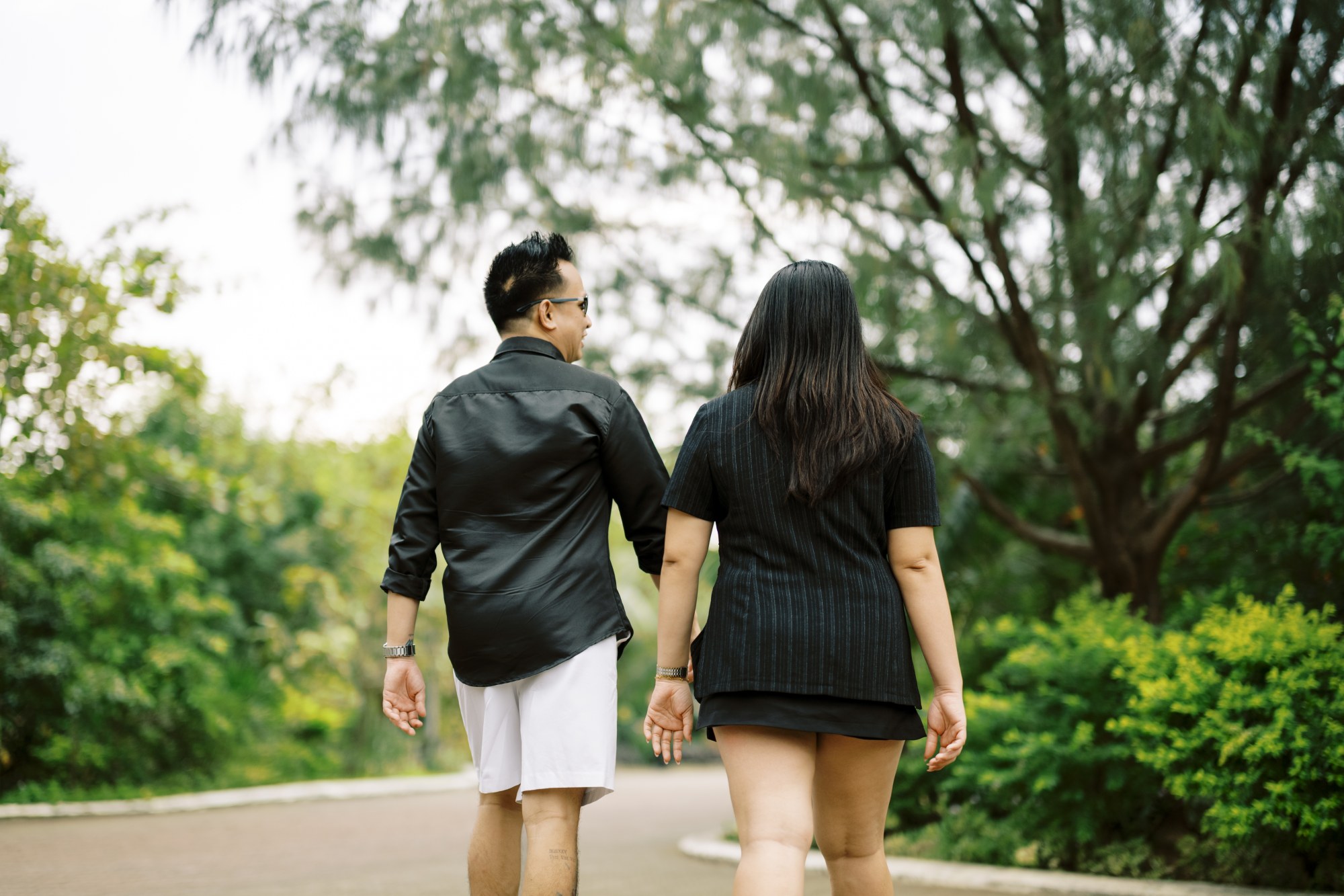 Rea and Charles walking hand in hand